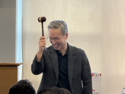 James Yoon receives a gavel as a farewell gift
