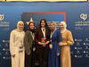 Debate Champion Foziea Garada next to her coach Dr. Eman Saadah holding her first place award at the U.S. Arabic Debate Championship