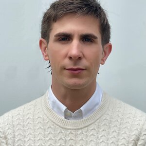portrait photo of Joshua Dees against a light background