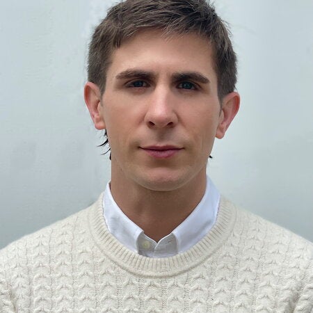 portrait photo of Joshua Dees against a light background